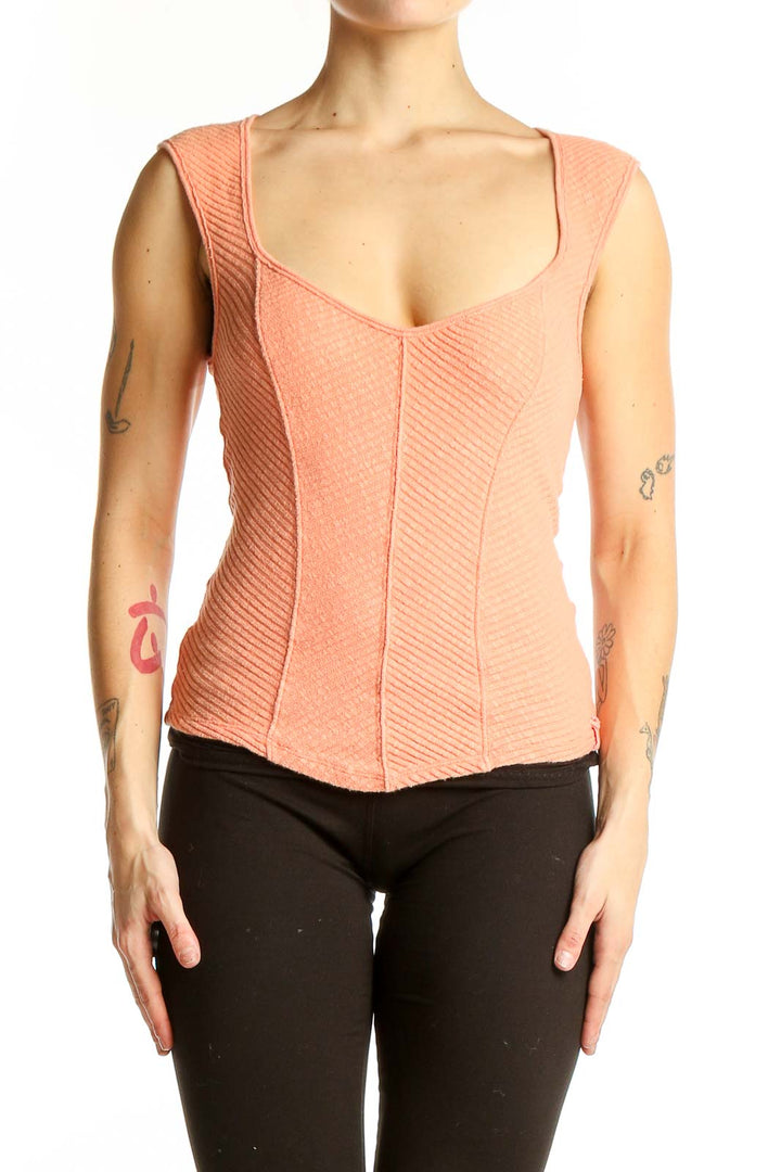 Front view of WE THE FREE peach textured sleeveless crop top