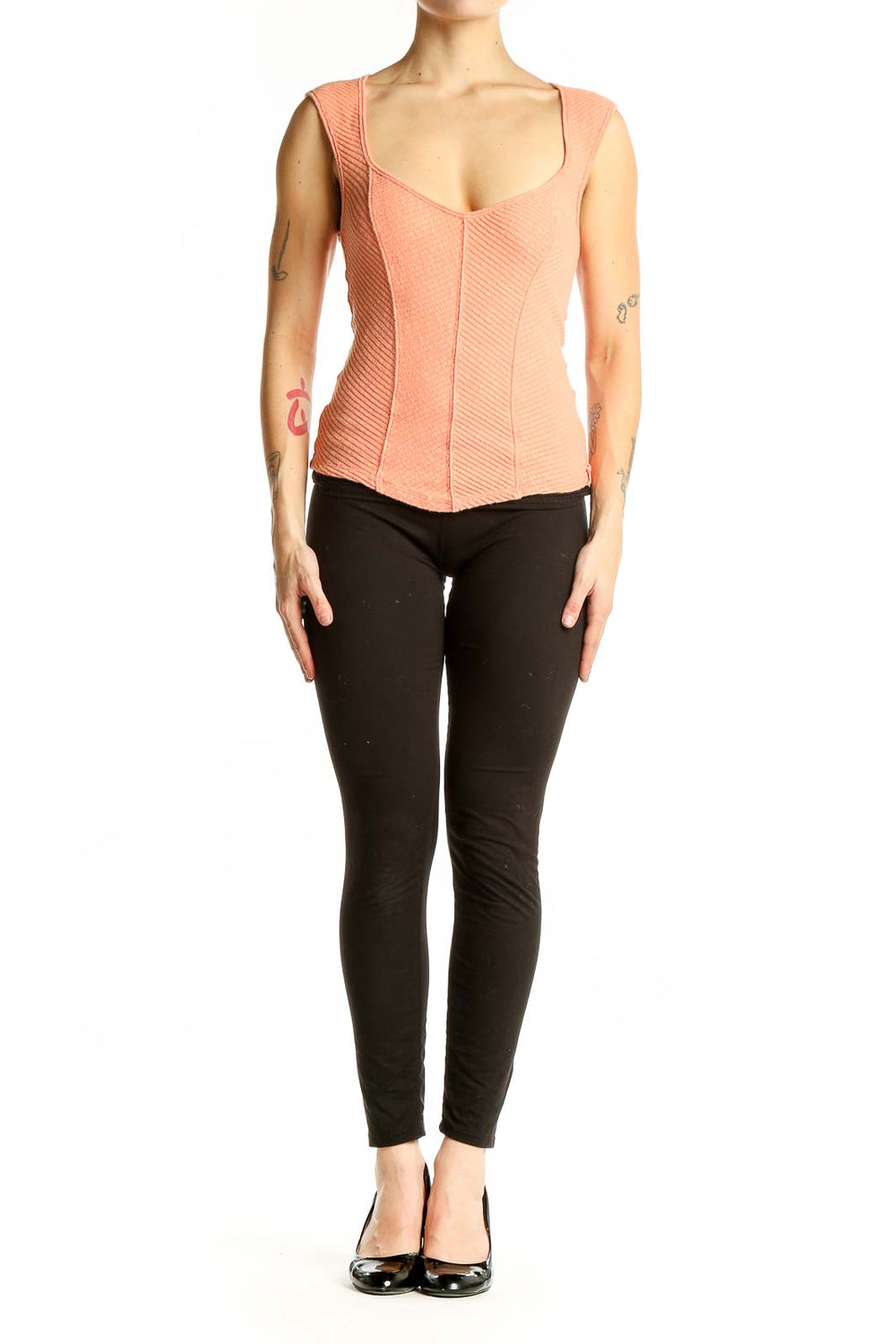 Front view of WE THE FREE peach textured sleeveless crop top