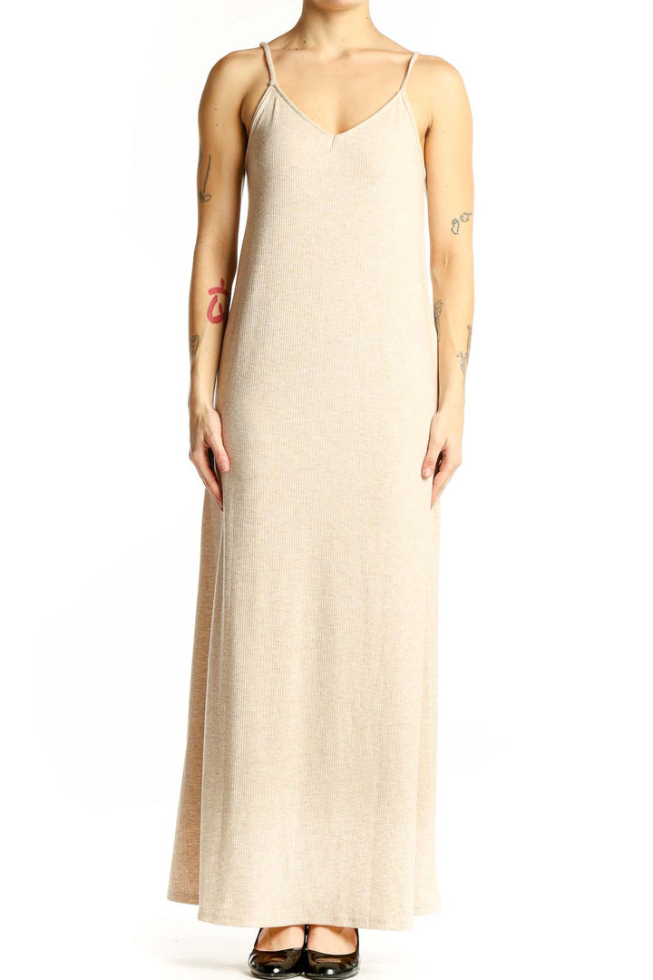 Front view of beige ribbed maxi dress with V-neck and spaghetti straps