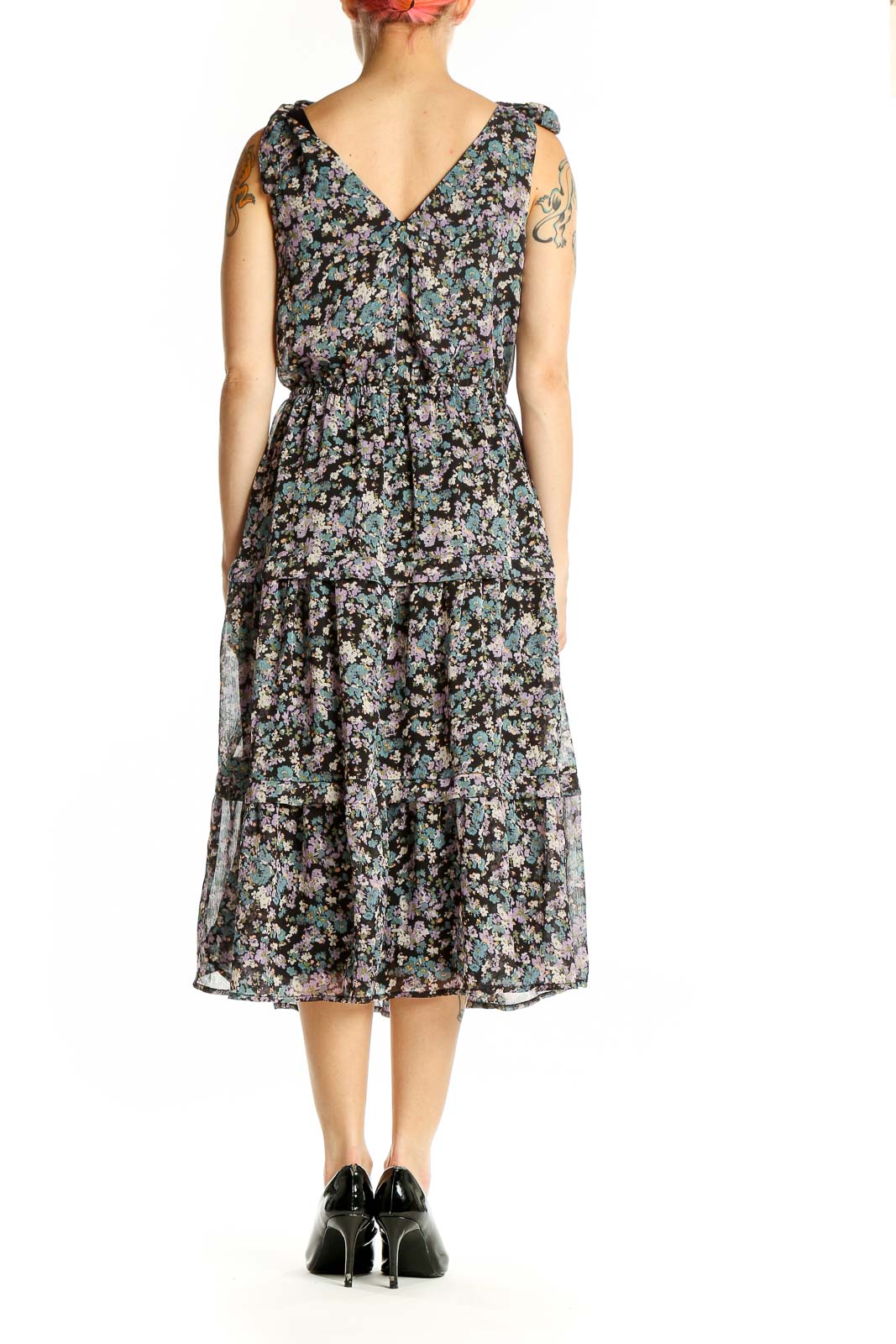 Side view of AVLN Studio black floral tiered midi dress