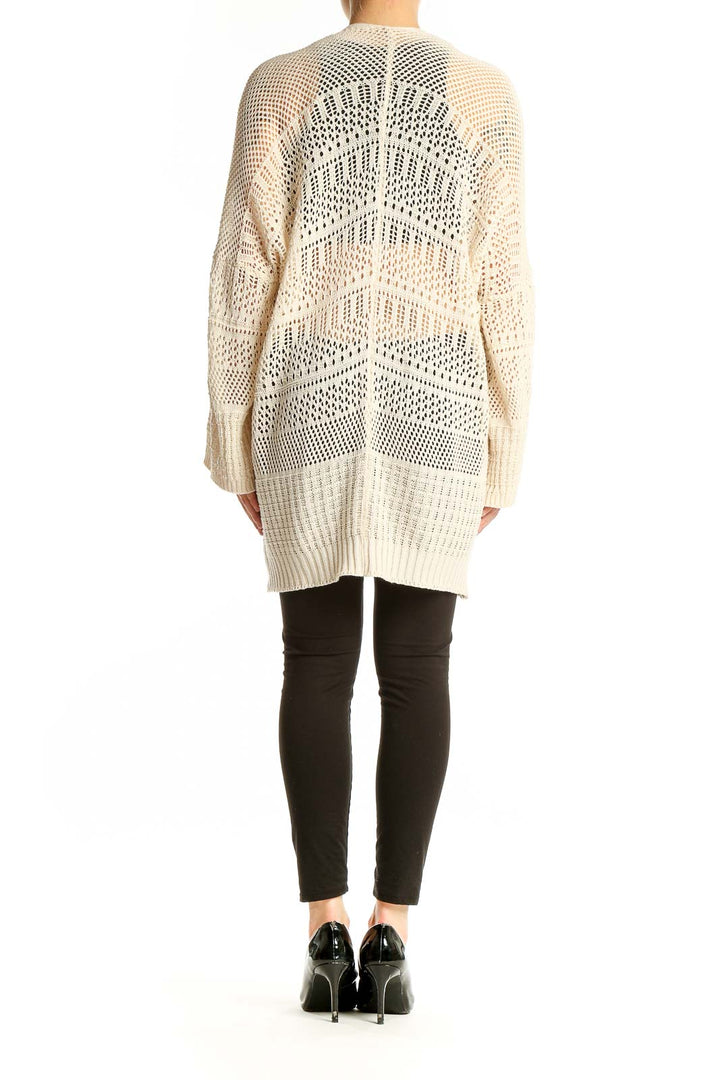 Side view of SilkRoll cream open-knit long cardigan on model