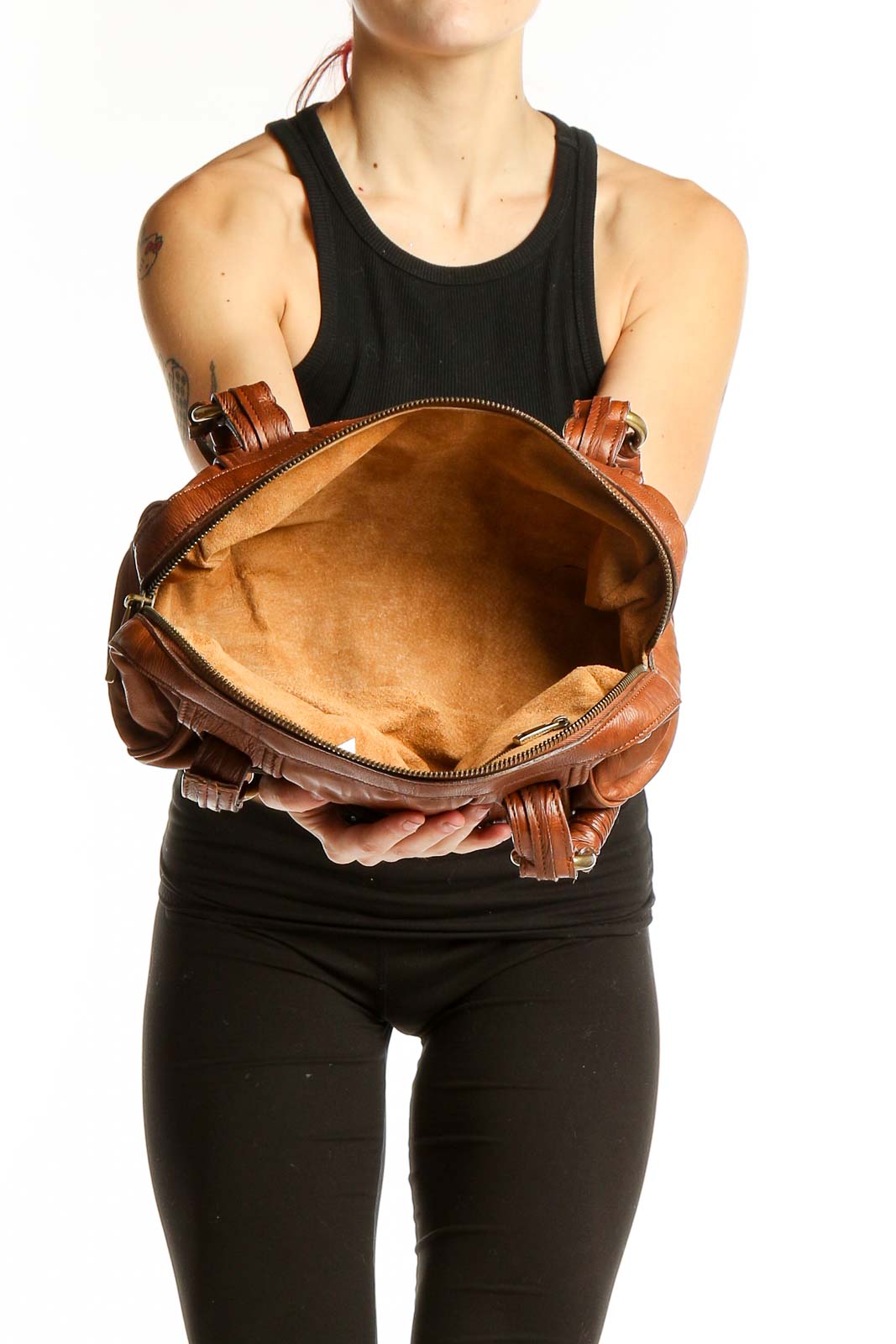 Front view of MARC JACOBS brown leather shoulder bag with tassel details