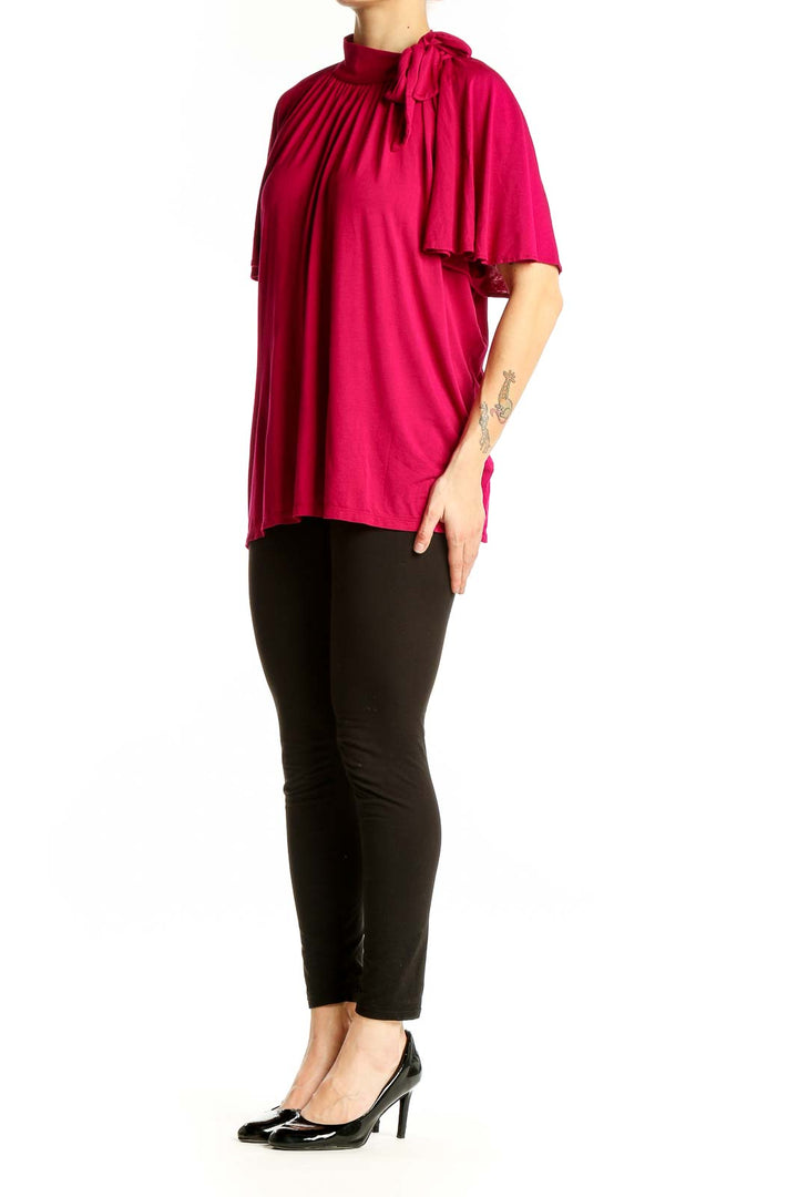 Front view of fuchsia Lauren Ralph Lauren top with cape sleeves and tie neckline