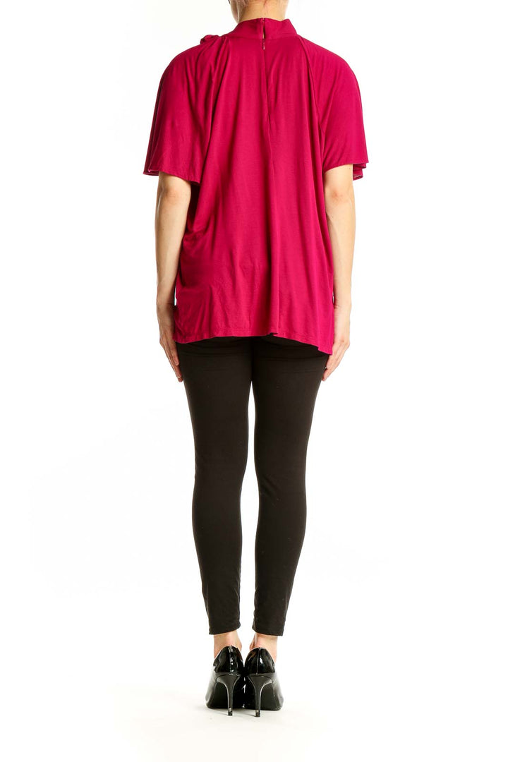 Side view of fuchsia Lauren Ralph Lauren top showing flowy cape sleeve design