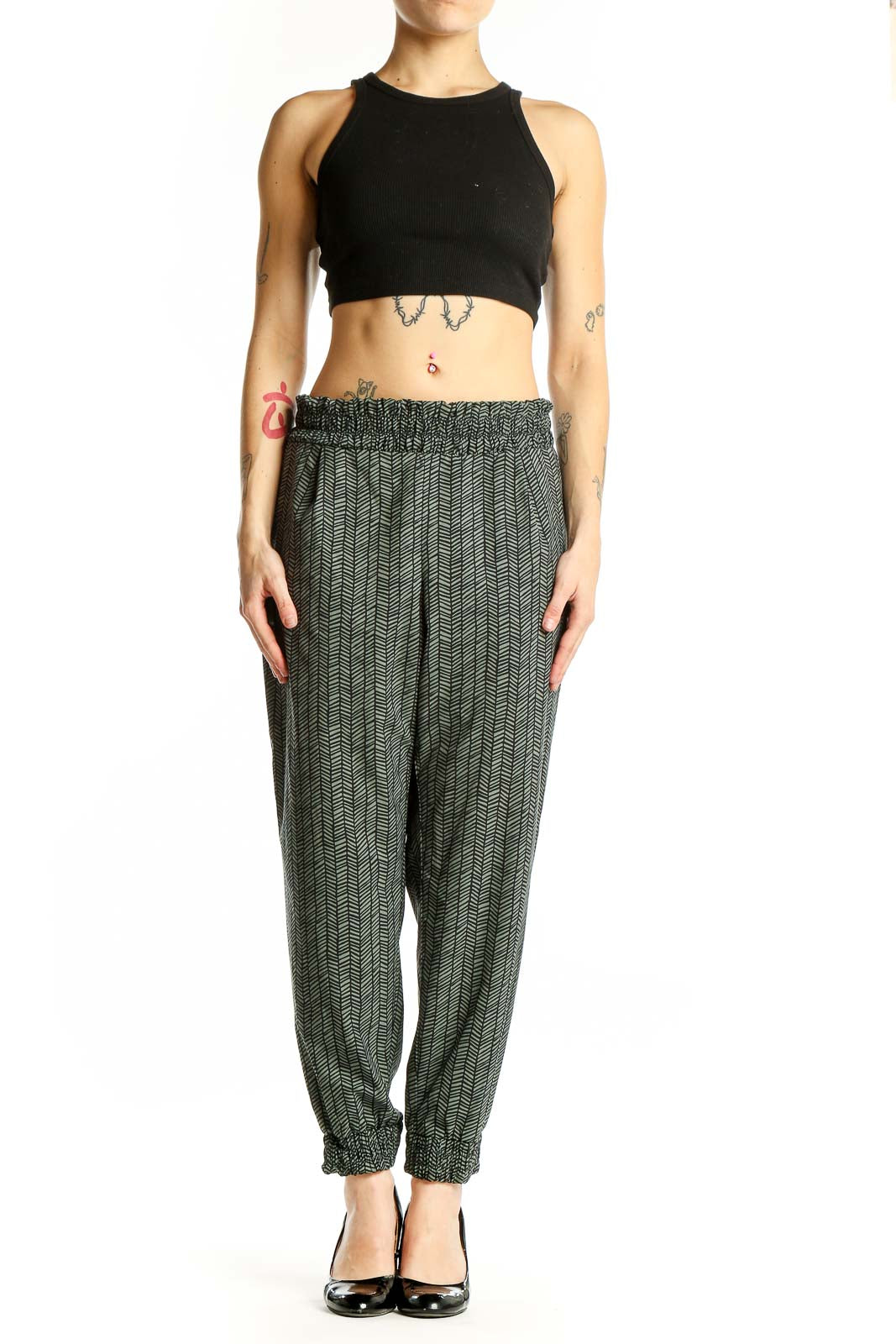 Front view of green herringbone pattern Athleta jogger pants
