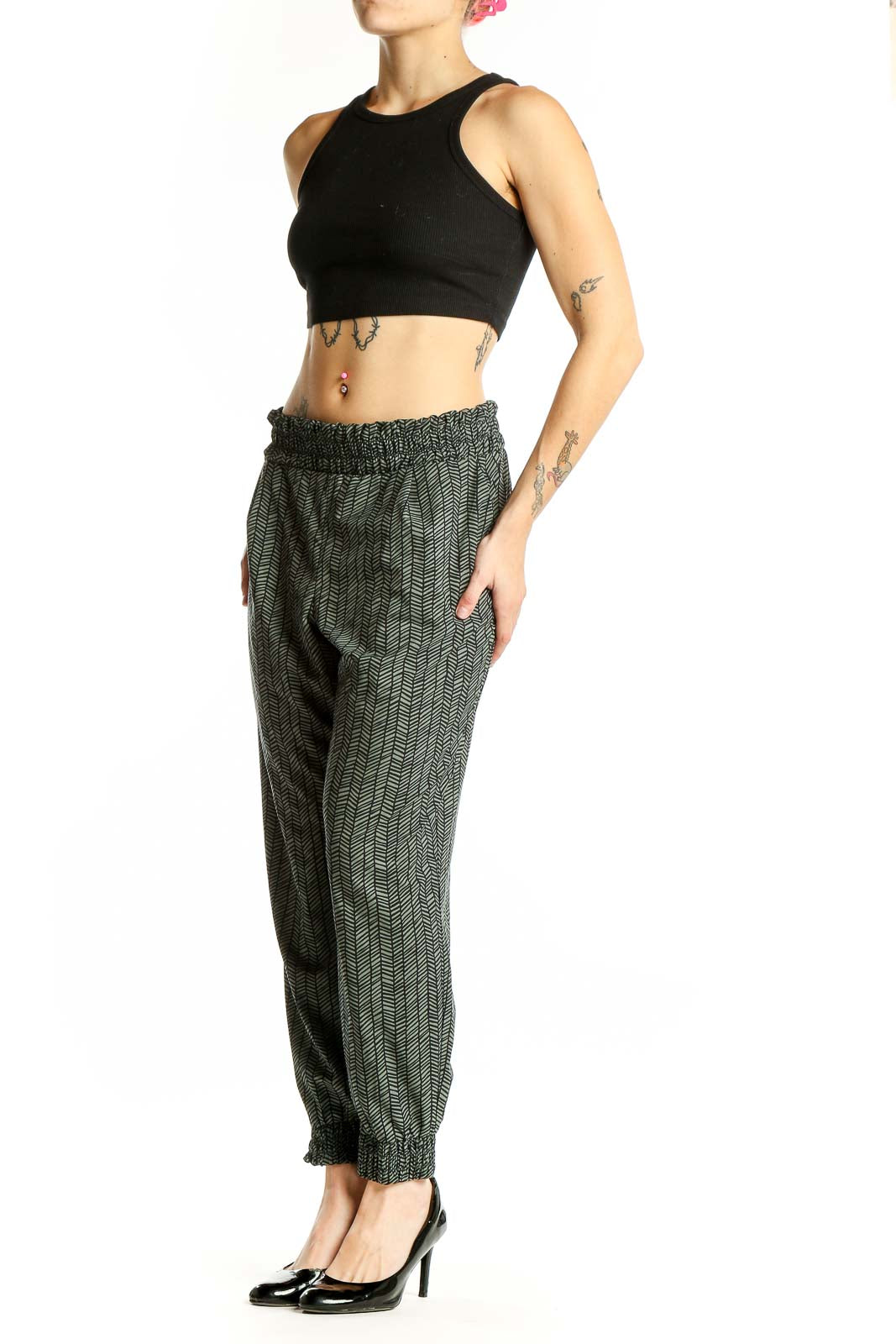 Front view of green herringbone pattern Athleta jogger pants