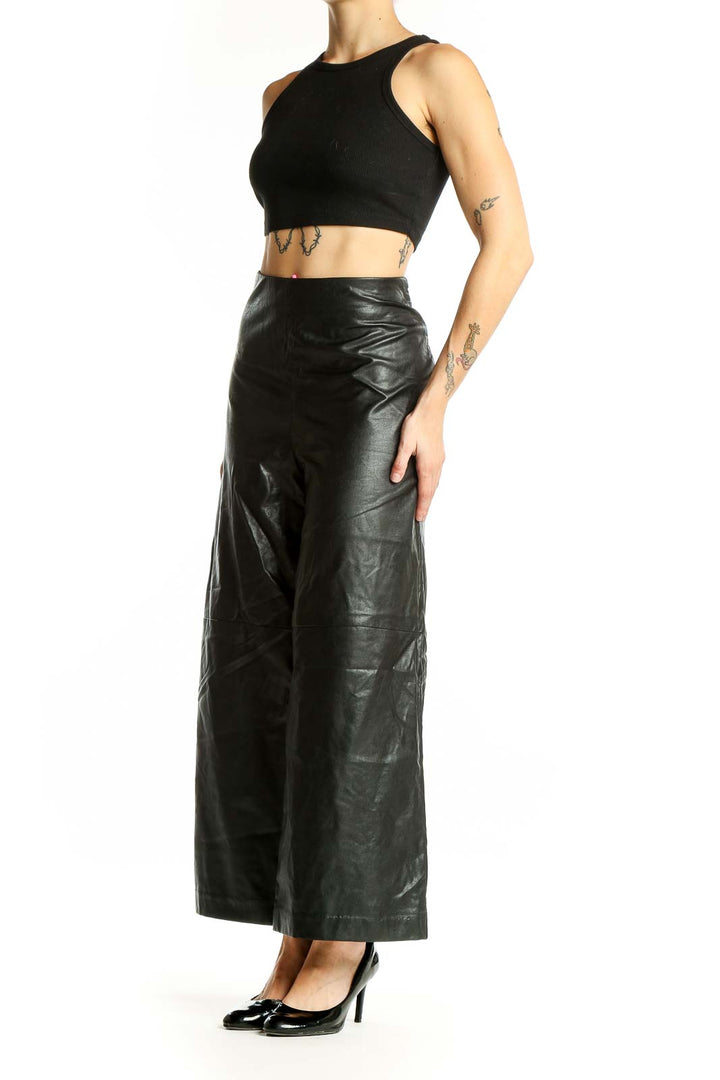 Front view of Karen Kane black faux-leather wide-leg pants