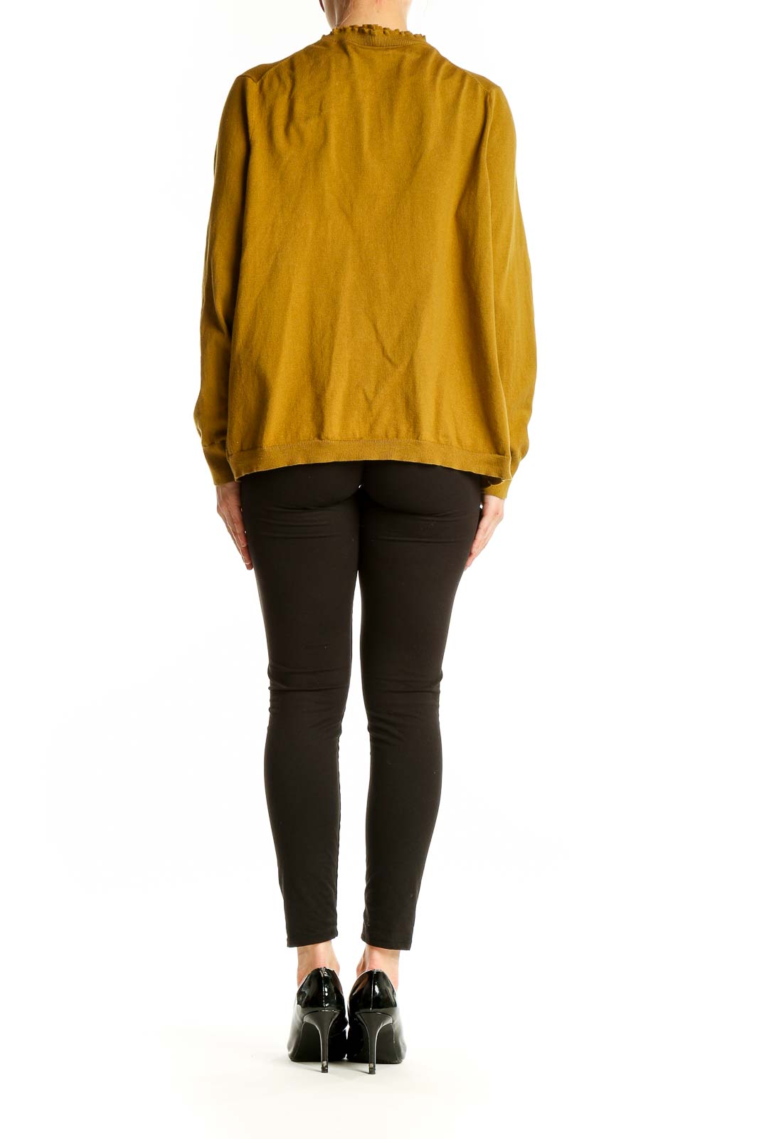 Side view of woman wearing mustard Lands' End cardigan over black outfit