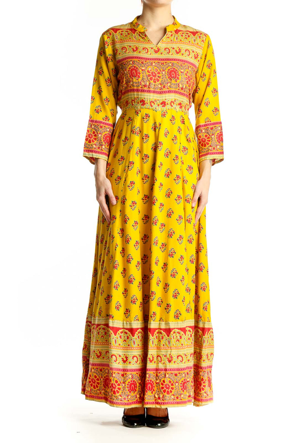 Front view of yellow floral maxi dress with empire waist and border prints