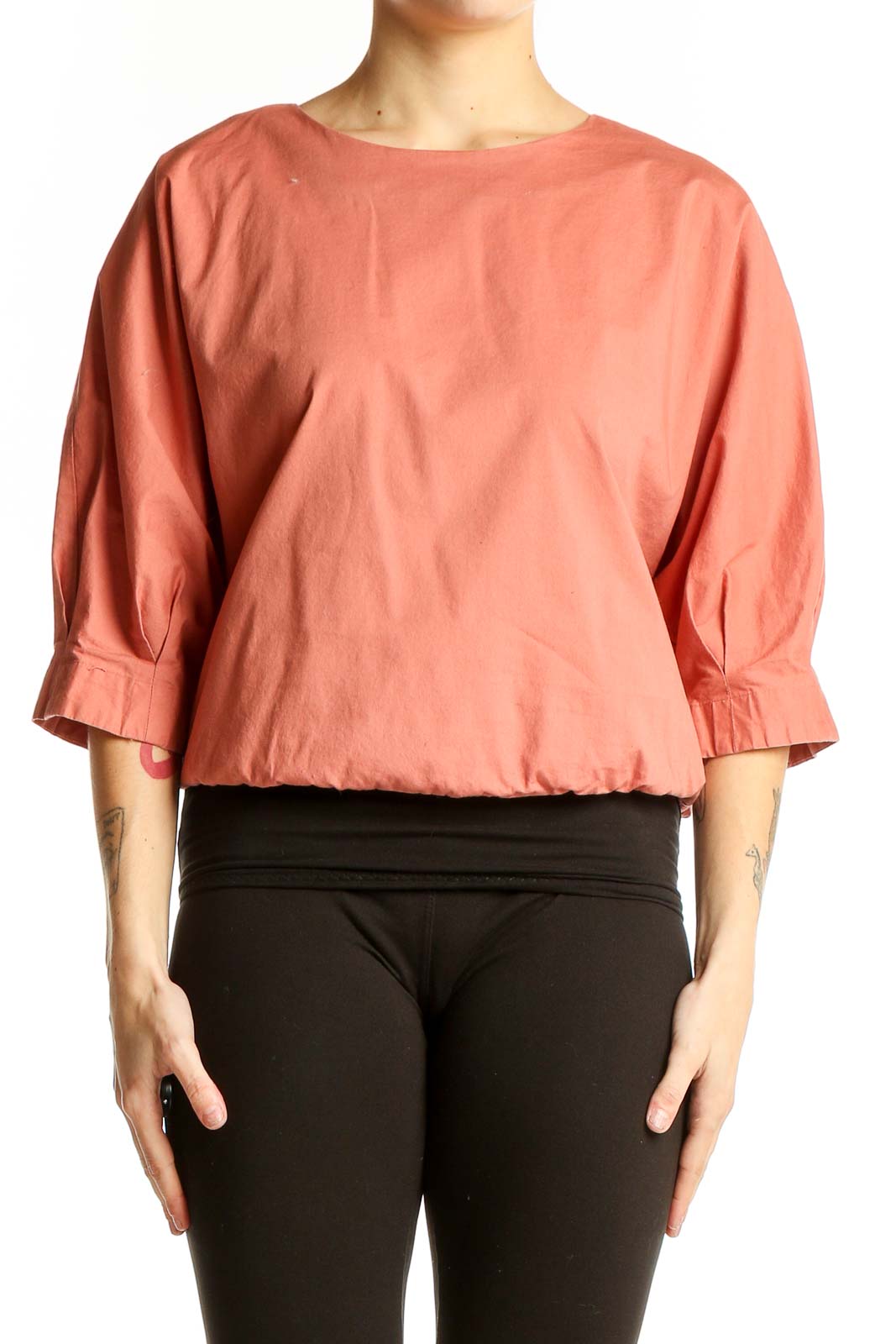 Front view of coral Prologue top with puff sleeves