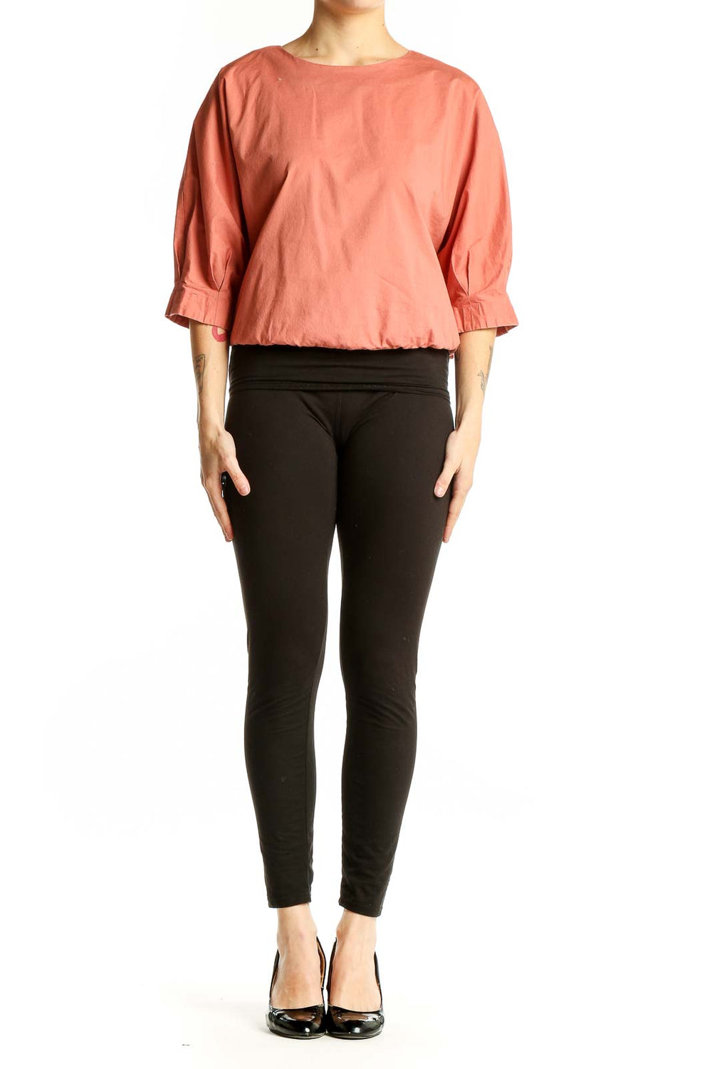 Front view of coral Prologue top with puff sleeves