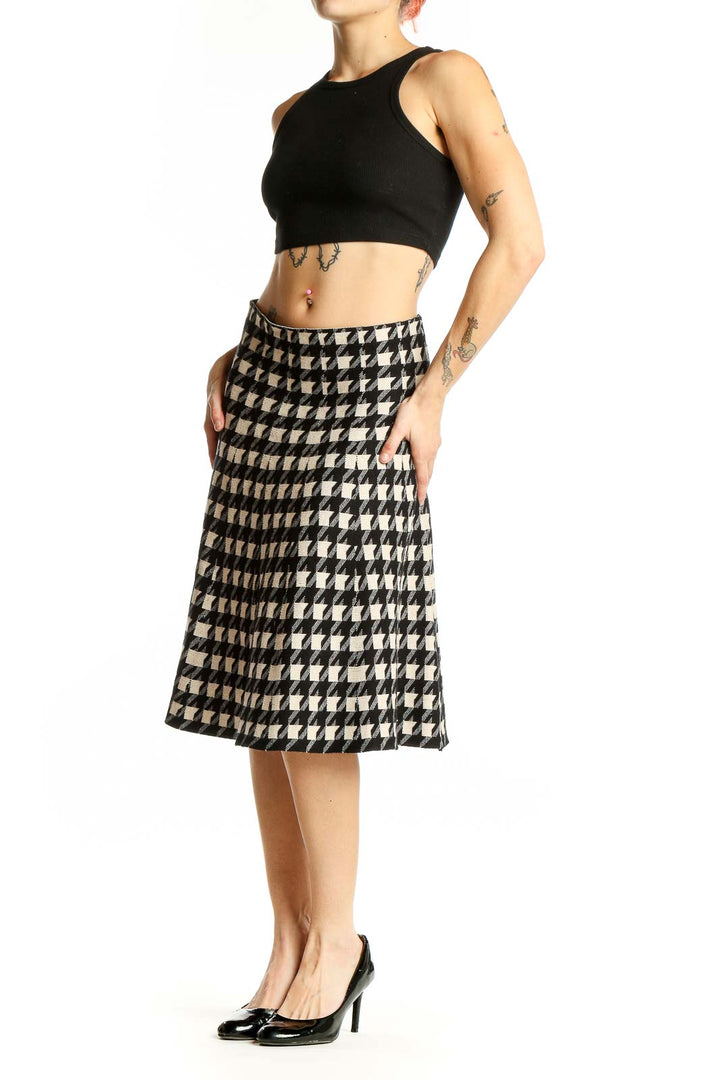 Front view of Max Studio black and white houndstooth A-line midi skirt