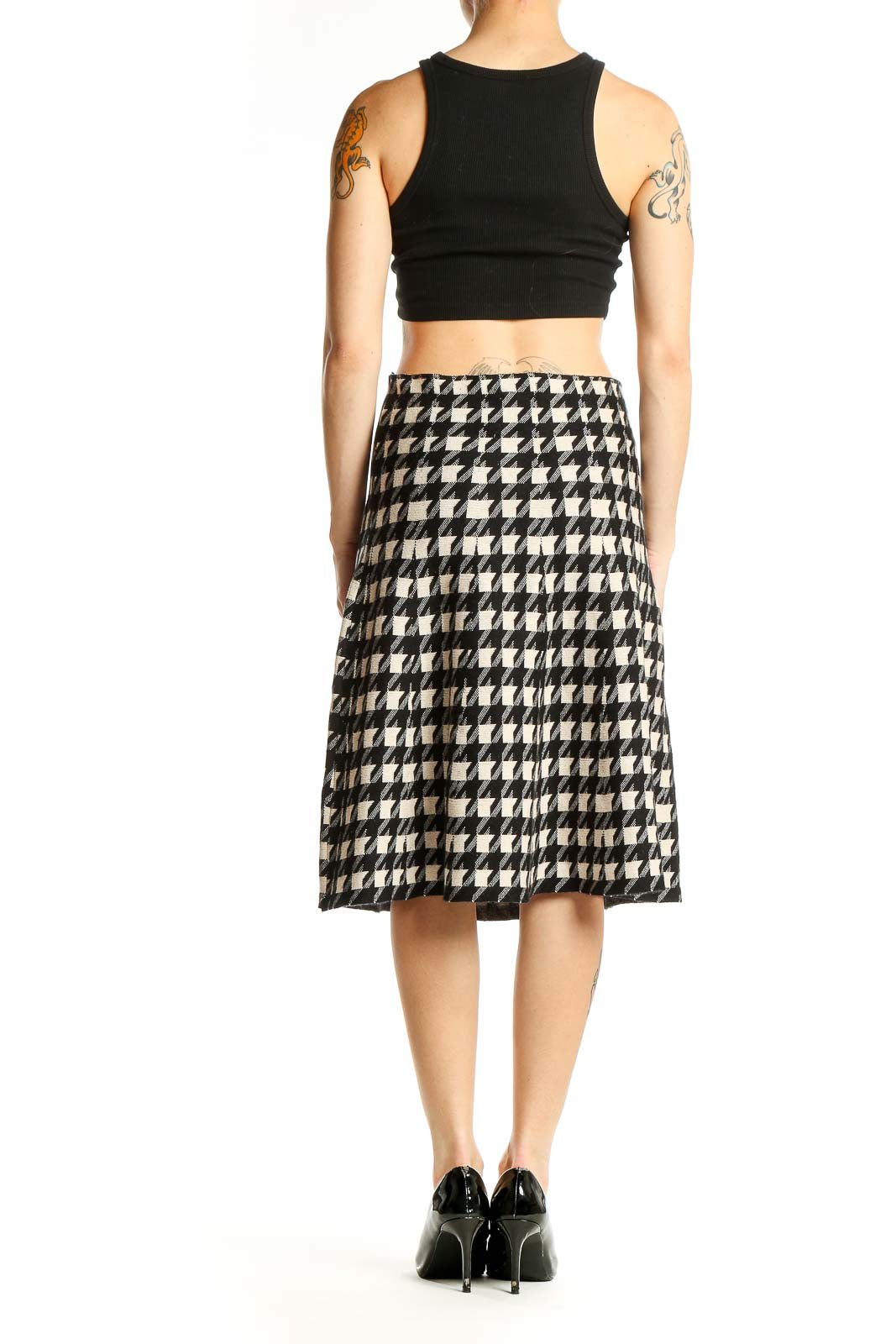 Side view of Max Studio black and white houndstooth A-line midi skirt with black crop top