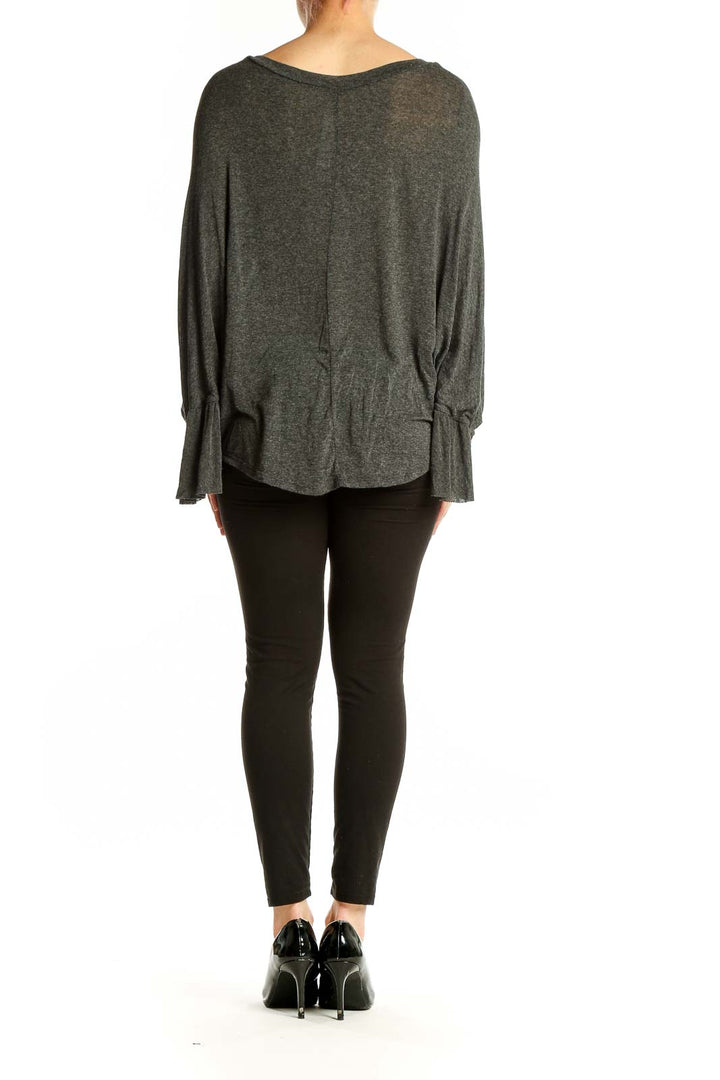 Back view of Robin K. charcoal V-neck dolman sleeve top with high-low hem