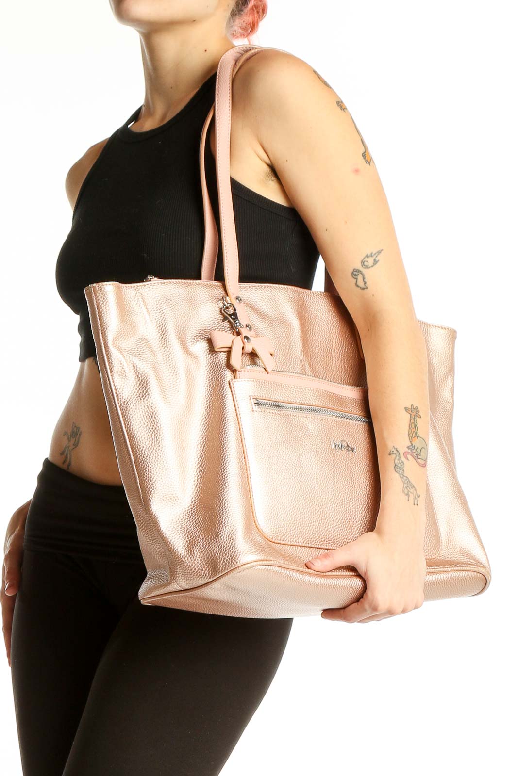 Front view of Kipling rose gold metallic tote bag with monkey keychain