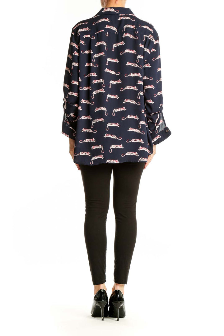 Back view of LOFT navy leopard print button-down blouse on model
