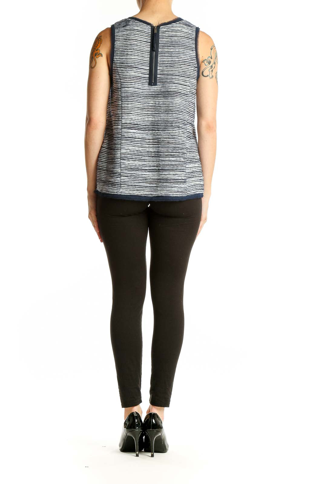 Side view of Anthropologie gray striped sleeveless top on model