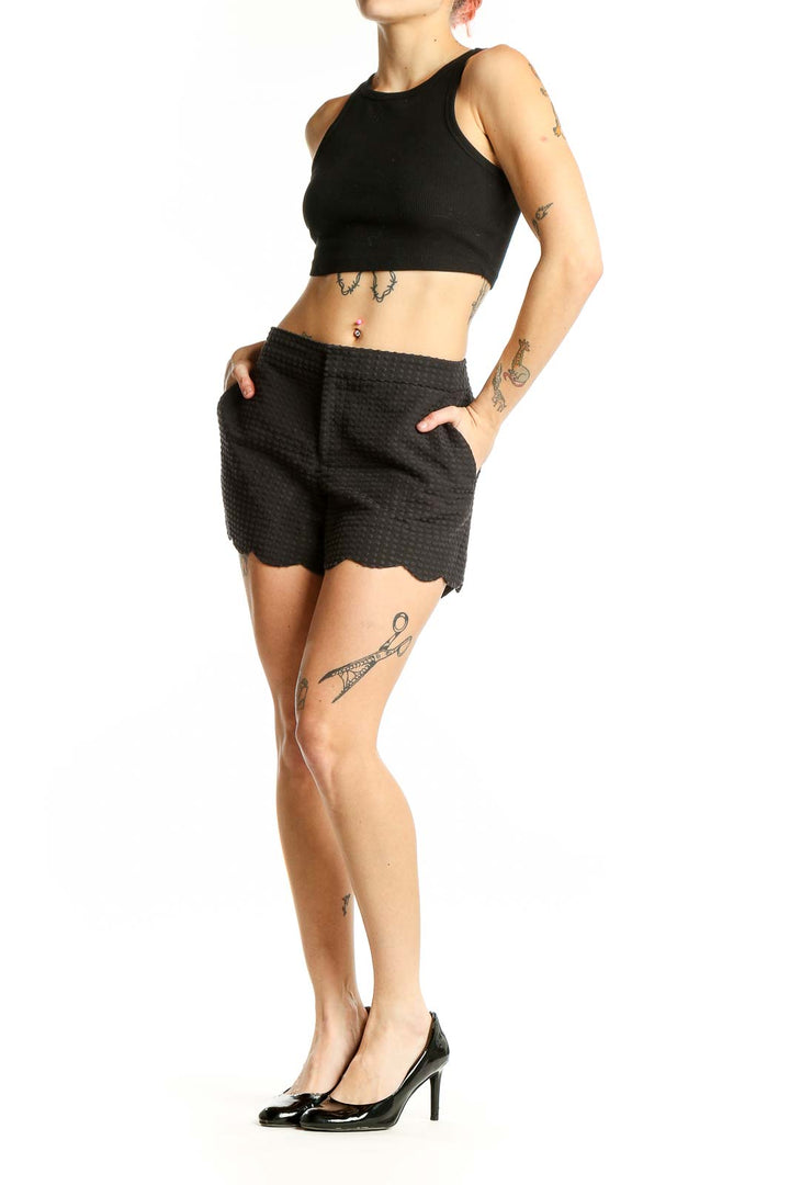Front view of Club Monaco black textured shorts with scalloped hem