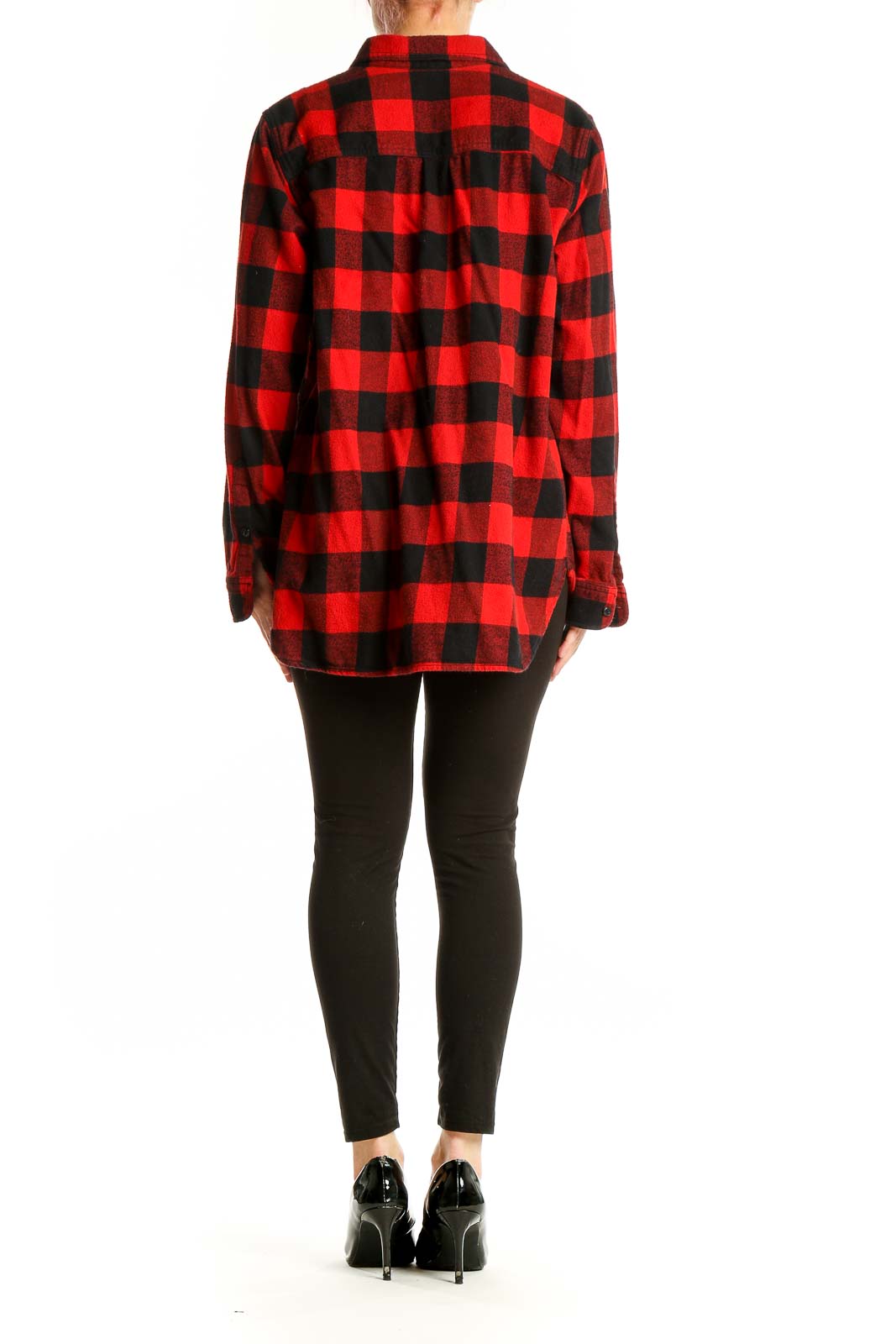 Side view of model wearing Madewell red and black buffalo check flannel shirt with black pants