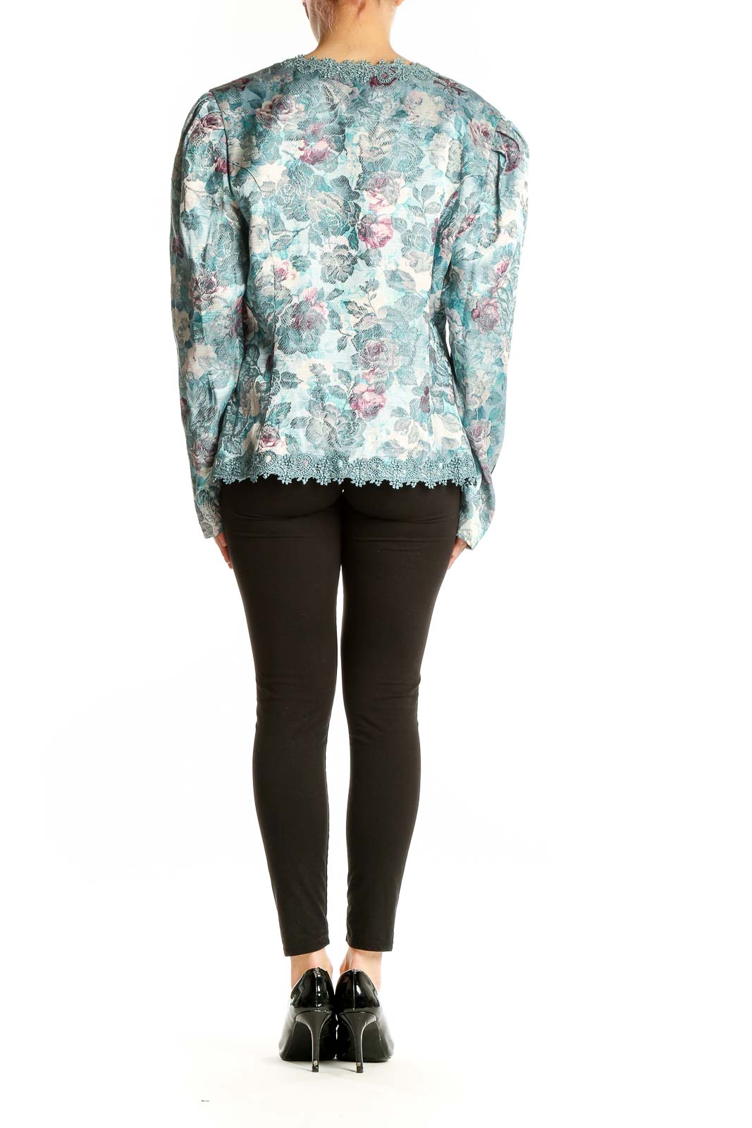 Back view of teal floral lace-trimmed jacket showing puffed sleeves and scalloped hem
