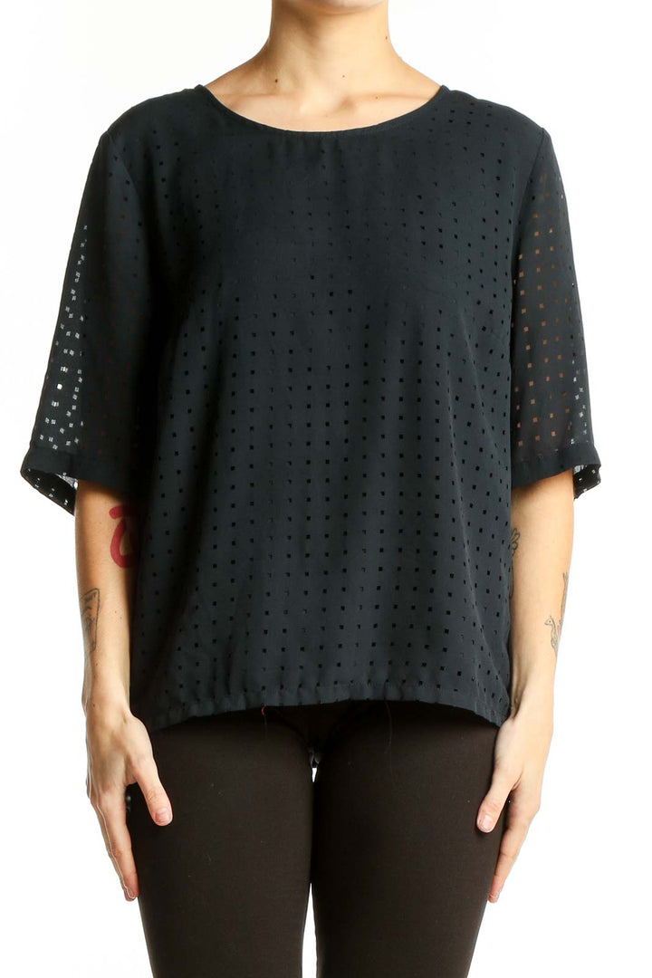 Front view of Banana Republic black perforated boxy blouse with dot pattern