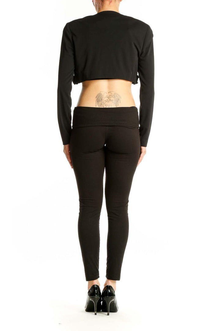 Back view of Niki LIvas Black Floral Embellished Cropped Bolero on model