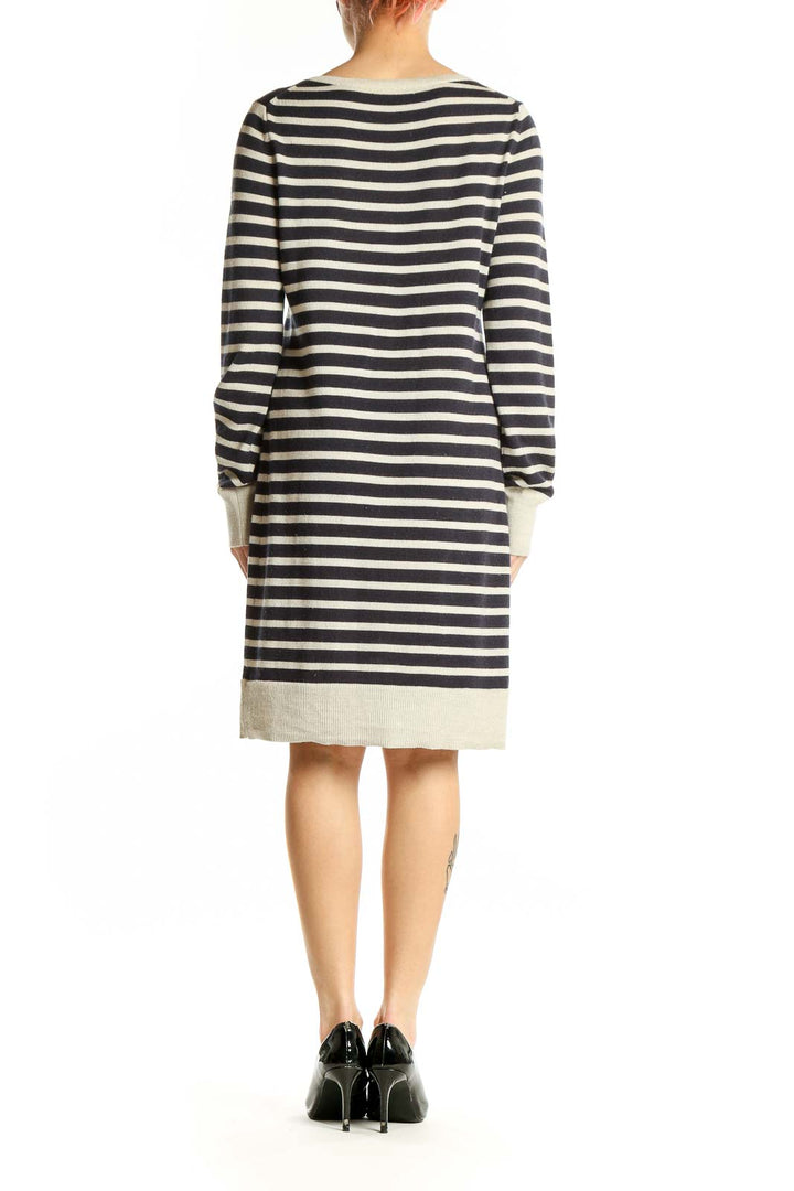 Side view of Gap navy and cream striped knit dress showing knee-length cut and relaxed fit