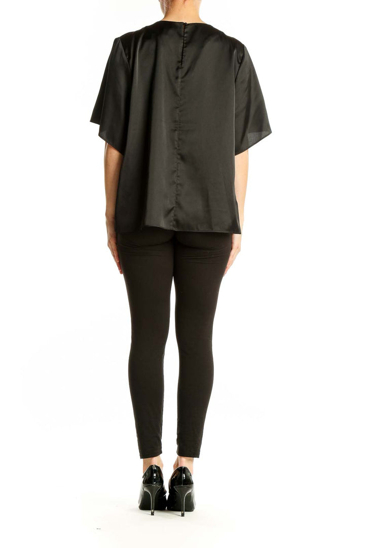 Back view of black Banana Republic blouse showing relaxed fit