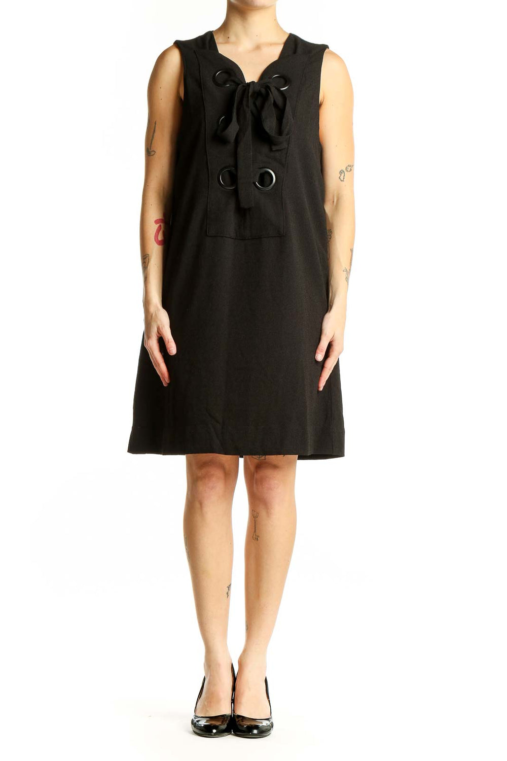 Front view of English Factory black sleeveless shift dress with bow-tie neckline