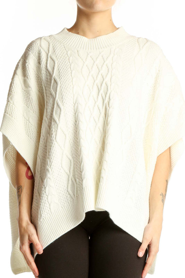 Front view of cream cable knit poncho sweater from J.Crew