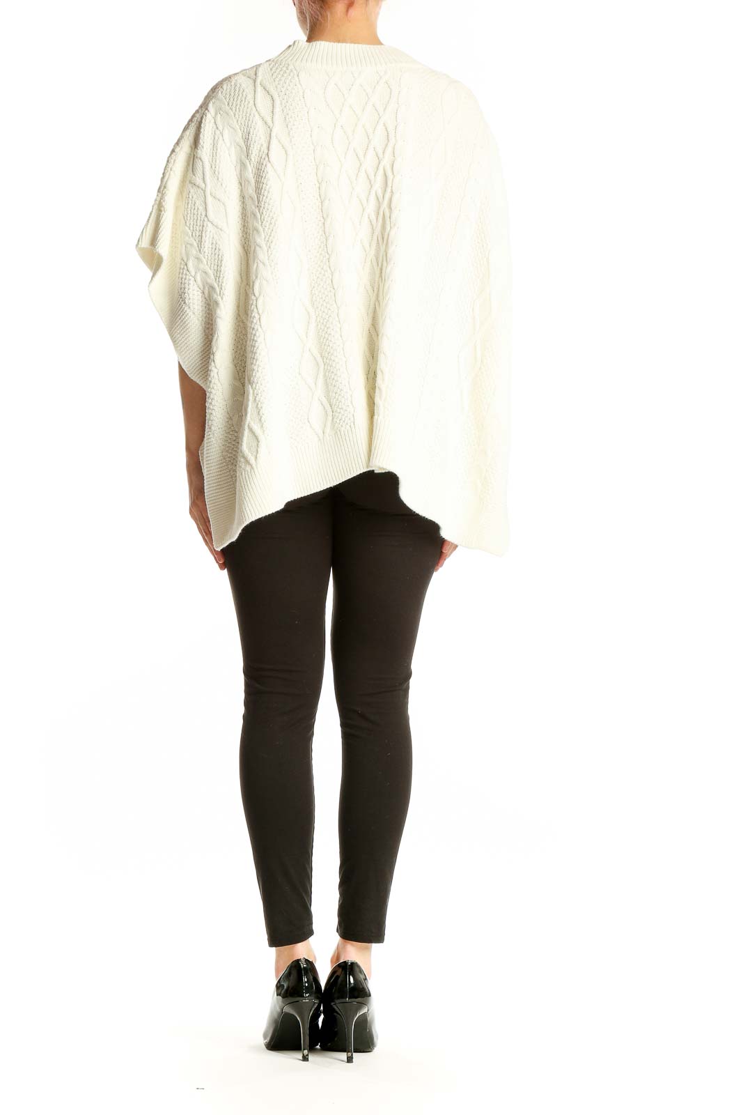 Side view of cream cable knit poncho sweater from J.Crew on model
