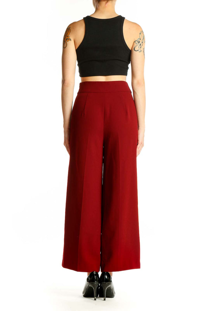 Side view of red wide-leg high-waisted trousers from Zara Woman