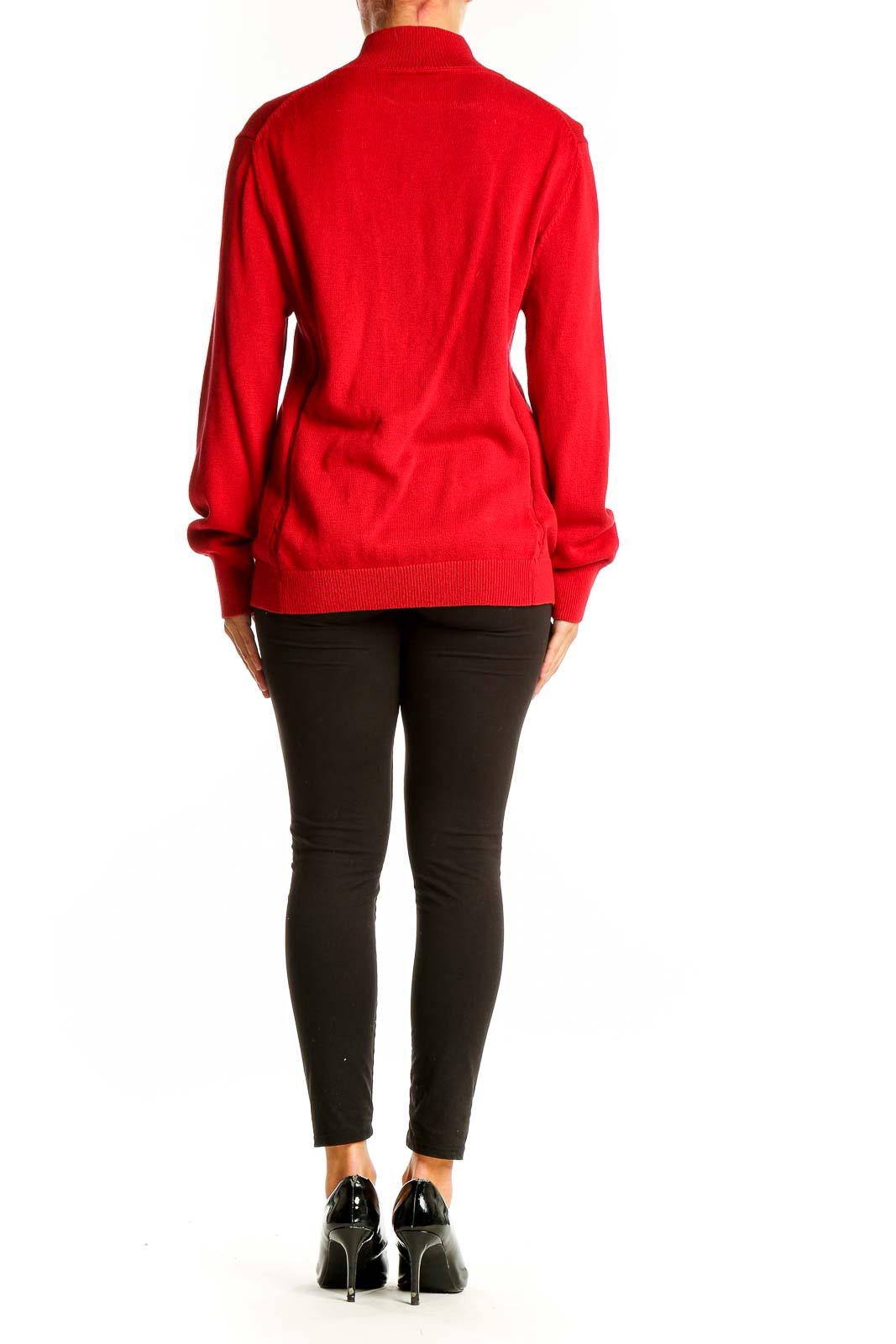 Side view of woman wearing red Tommy Hilfiger zip-up knit cardigan with black pants
