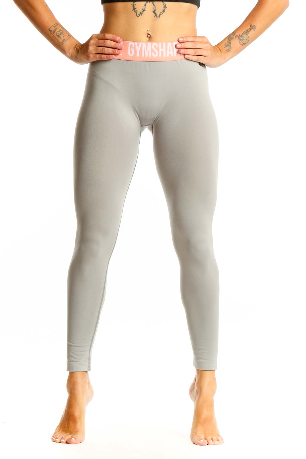 Front view of Gymshark gray high-waisted leggings with pink waistband