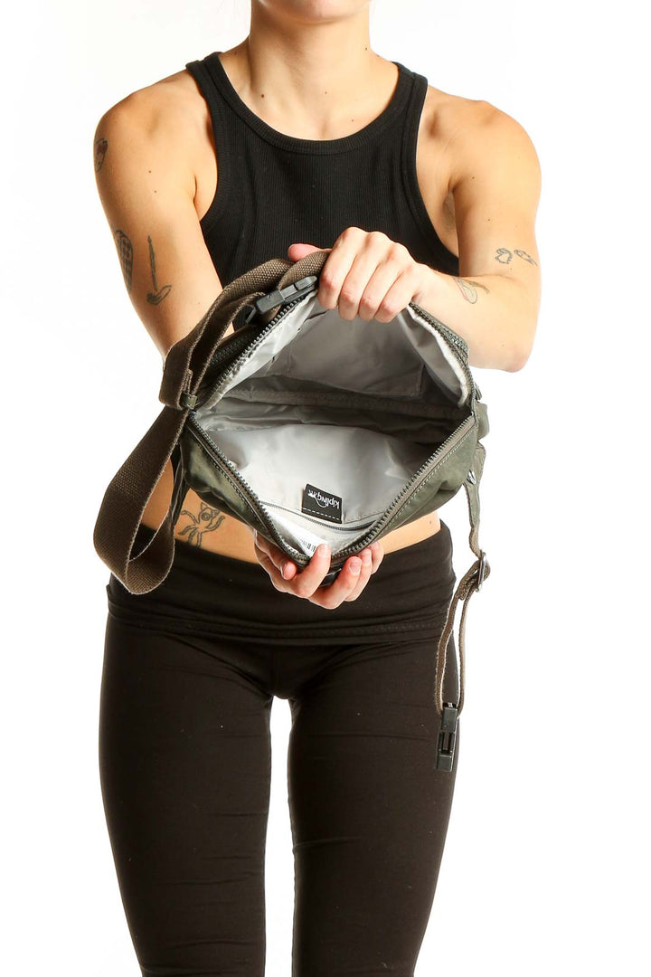Olive green Kipling crossbody bag worn by model, showcasing size and style