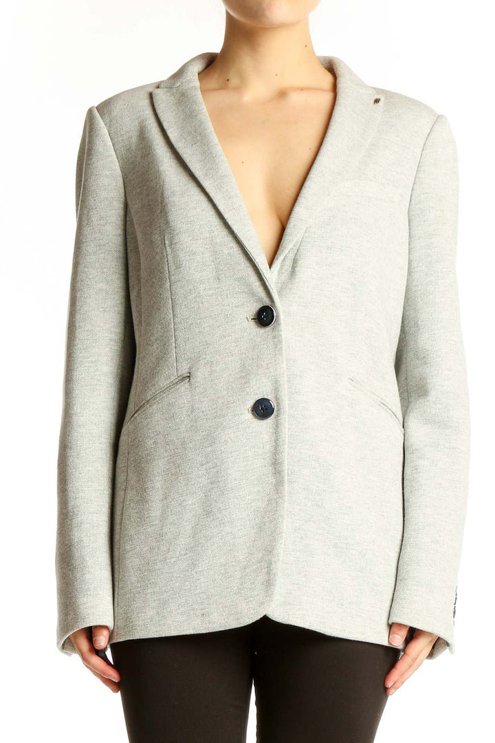 Front view of light gray Tommy Hilfiger blazer with notched lapels and two-button closure
