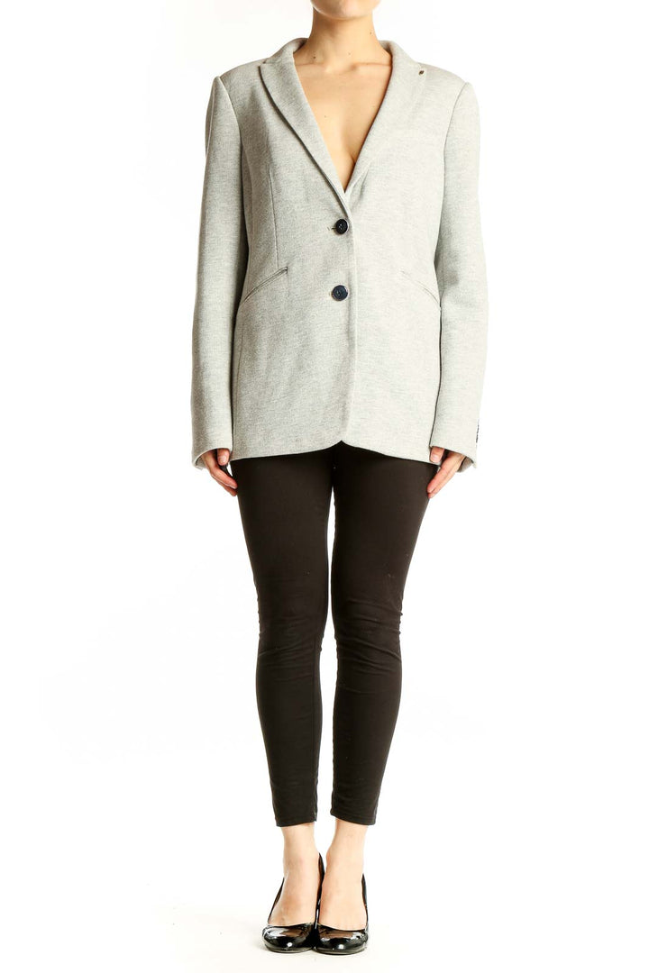 Front view of light gray Tommy Hilfiger blazer with notched lapels and two-button closure