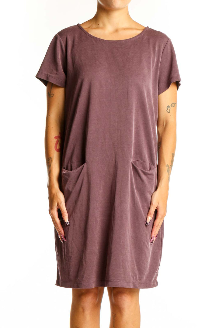Front view of Tahari mauve t-shirt dress with relaxed fit and front pockets