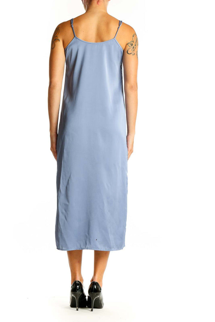 Side view of J.Crew blue satin slip midi dress showing side slit