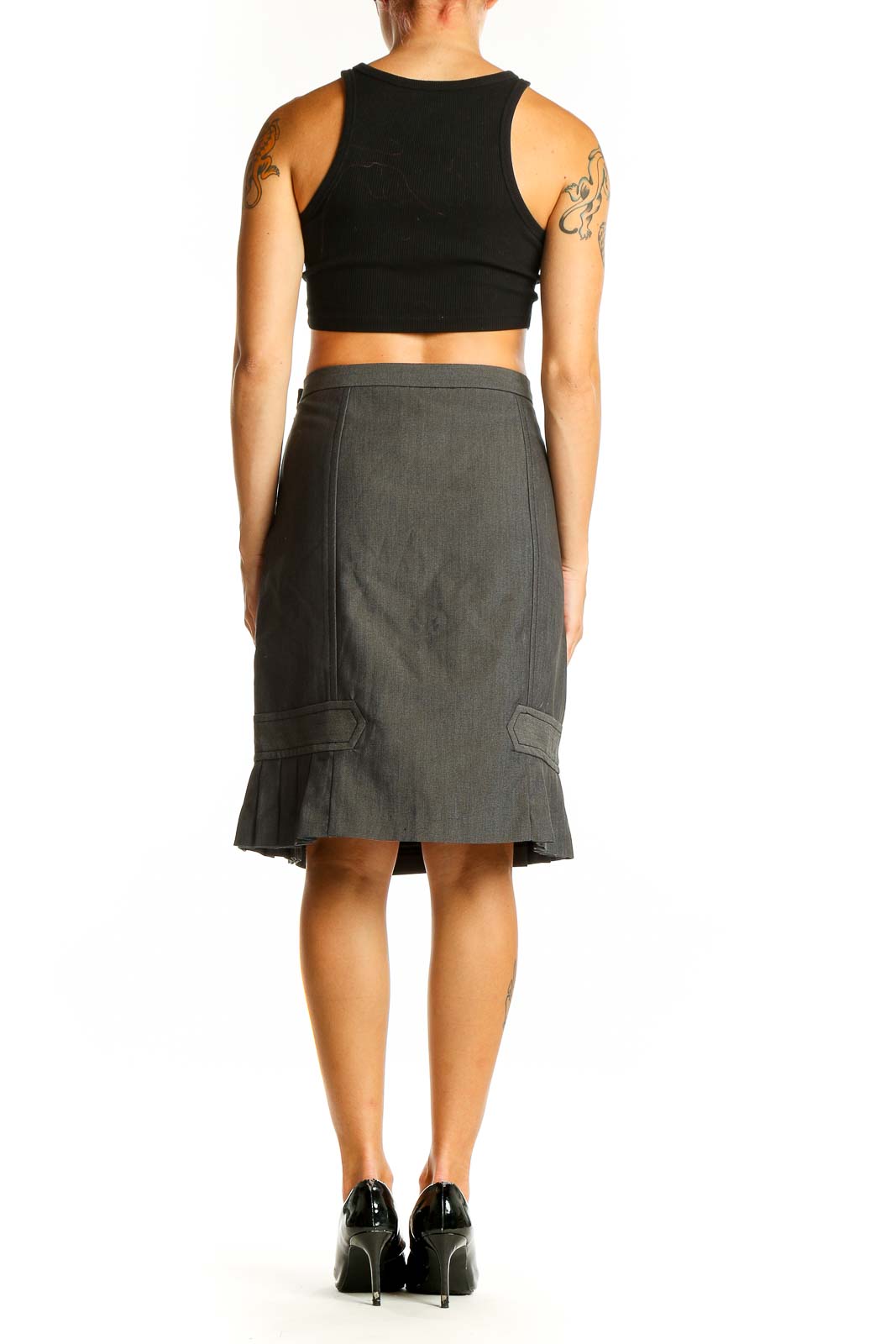 Side view of gray Max Studio pencil skirt on model with black top