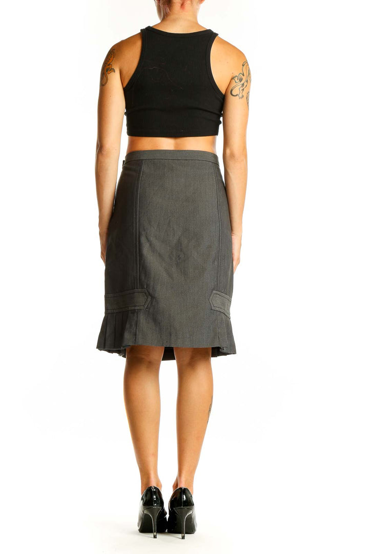 Side view of gray Max Studio pencil skirt on model with black top