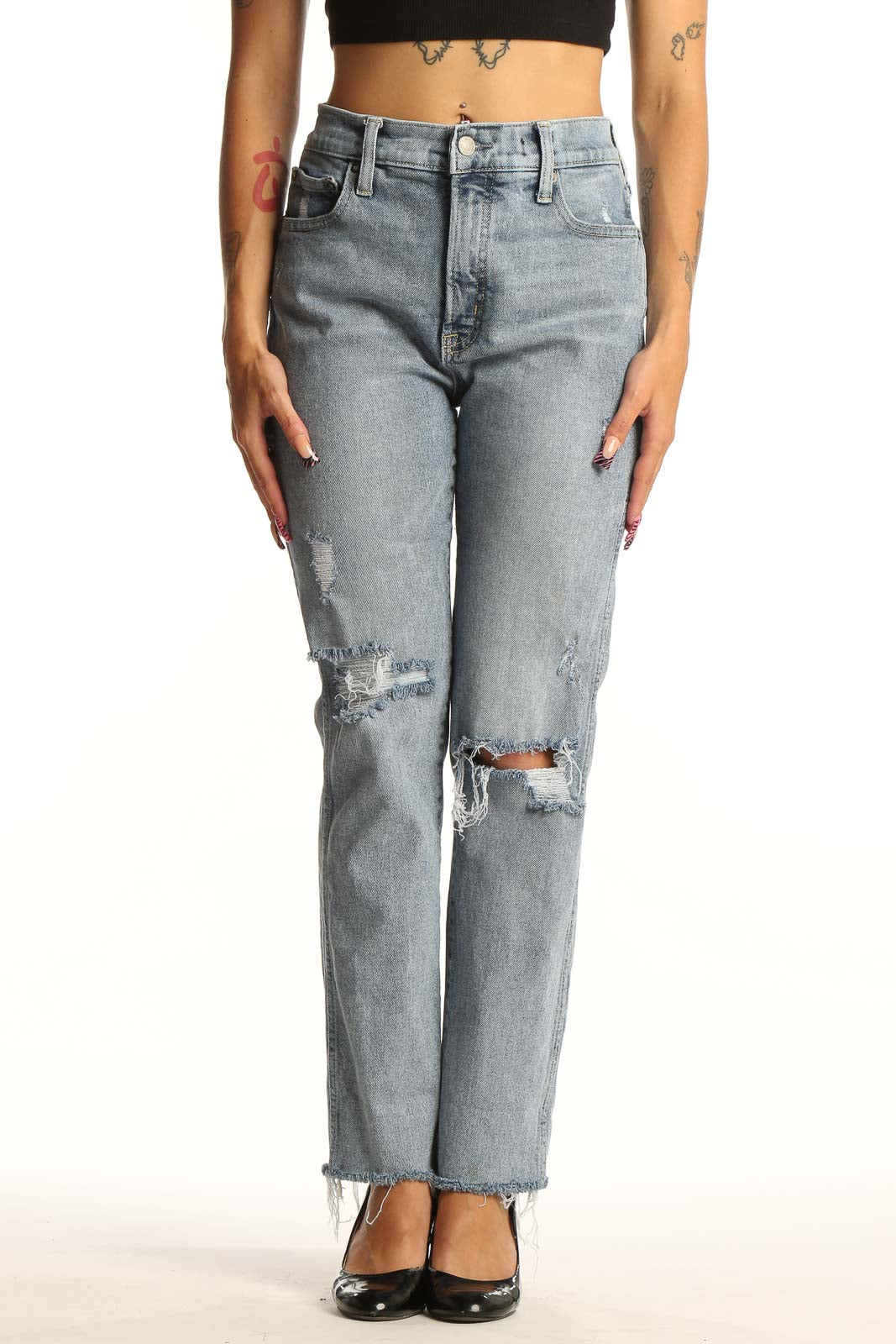 Front view of Mother light blue distressed straight leg jeans on model