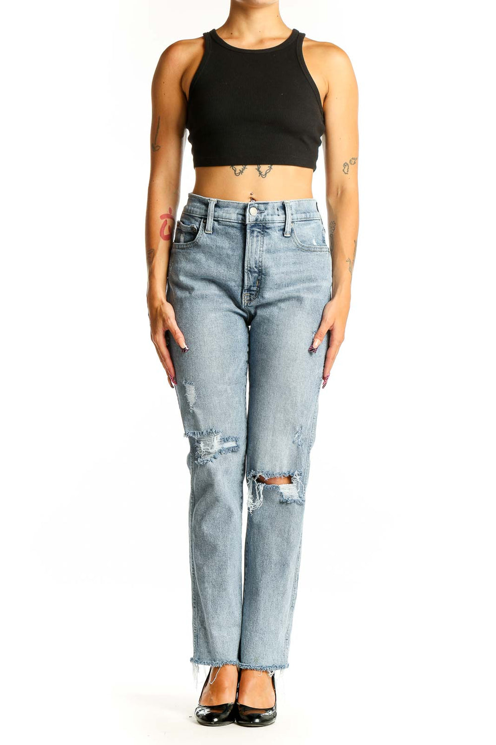 Front view of Mother light blue distressed straight leg jeans on model