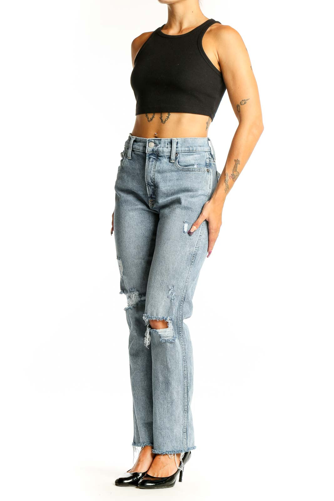 Front view of Mother light blue distressed straight leg jeans on model