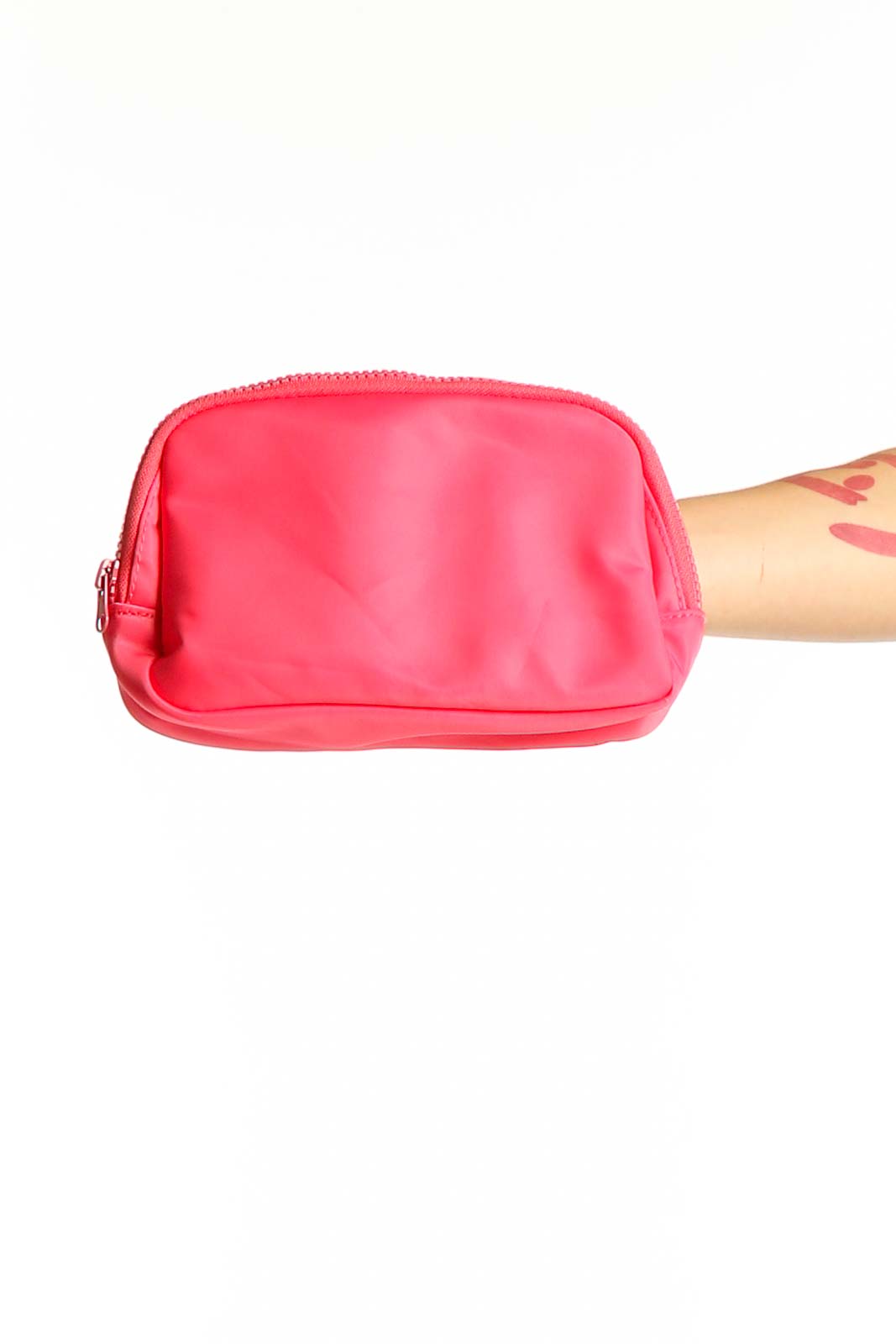 Front view of pink compact crossbody bag by SilkRoll