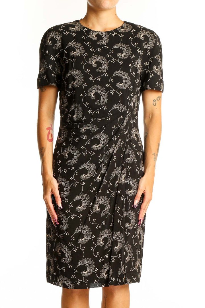 Front view of Tahari black sheath dress with floral embroidery