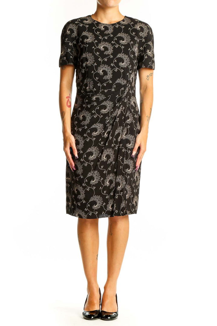 Front view of Tahari black sheath dress with floral embroidery