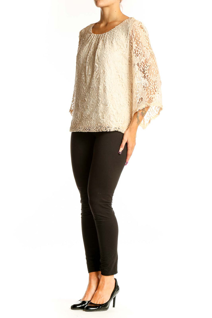 Front view of cream lace blouse with scoop neckline and 3/4 bell sleeves