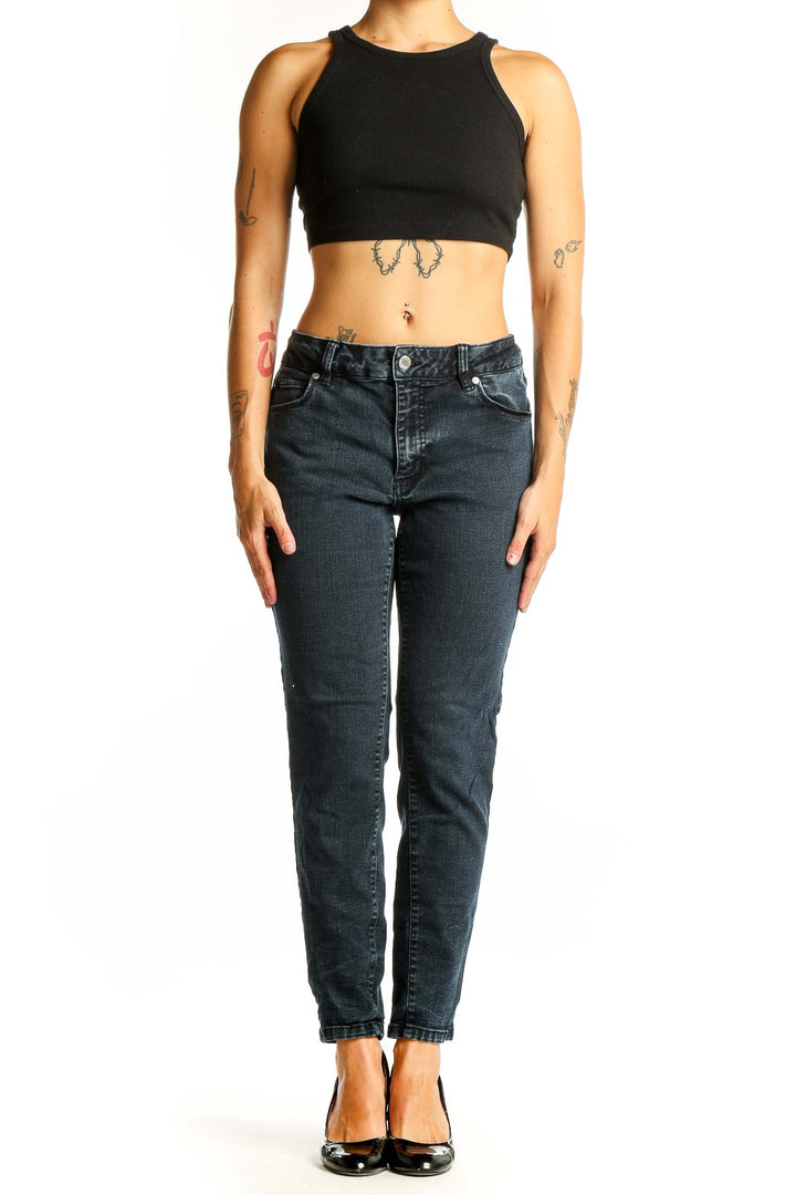 Front view of Tahari dark blue tapered denim jeans on model