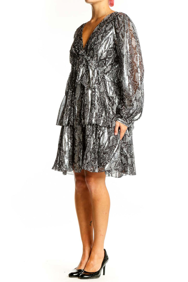 Front view of MICHAEL Michael Kors silver metallic snakeskin print cocktail dress with V-neck and tiered ruffles
